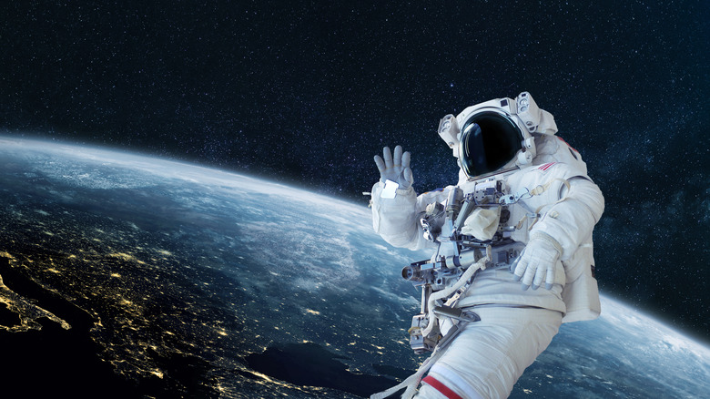 Astronaut in space above earth
