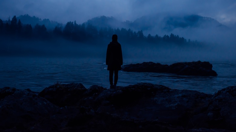 person standing in dark