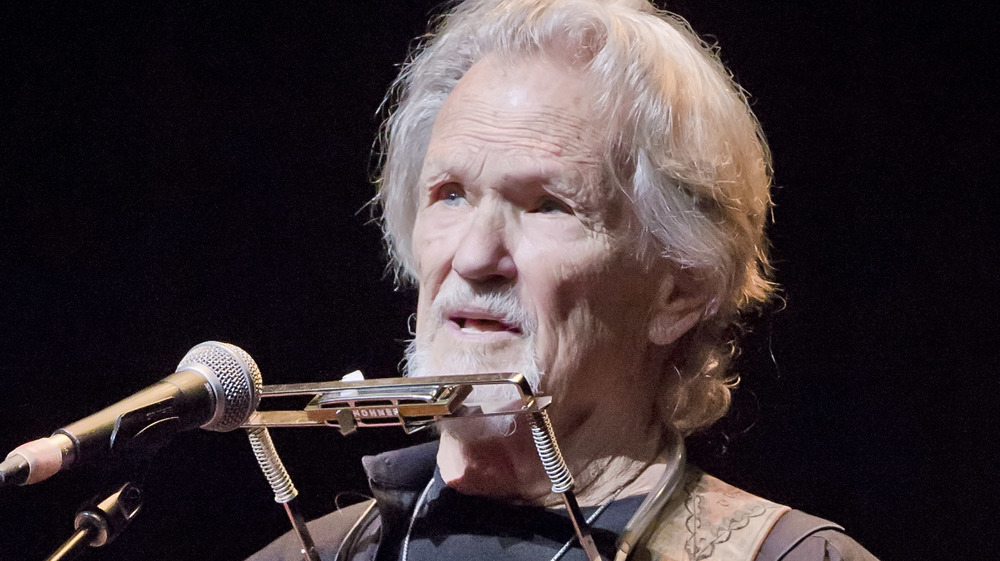 Kris Kristofferson singing on stage