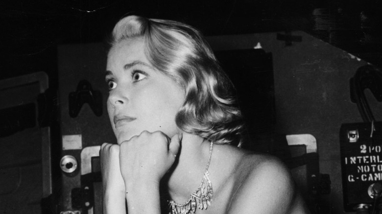 grace kelly head on hands