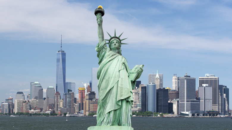 Statue of Liberty in front of new york skyline