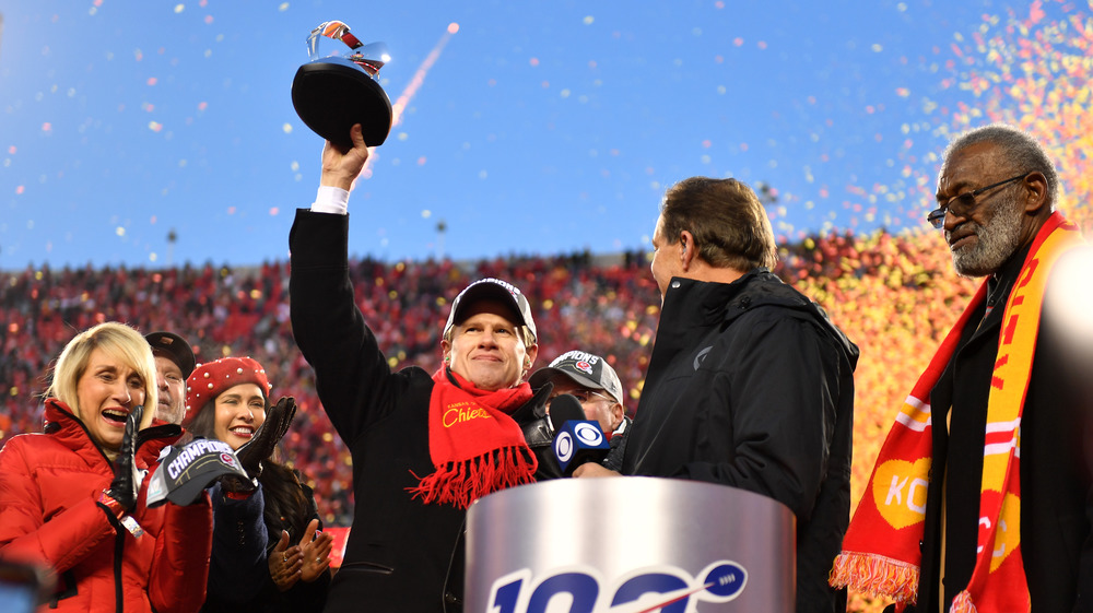 Clark Hunt holding trophy