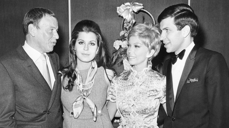 Frank, Tina, Nancy, and Frank Sinatra Jr. smiling