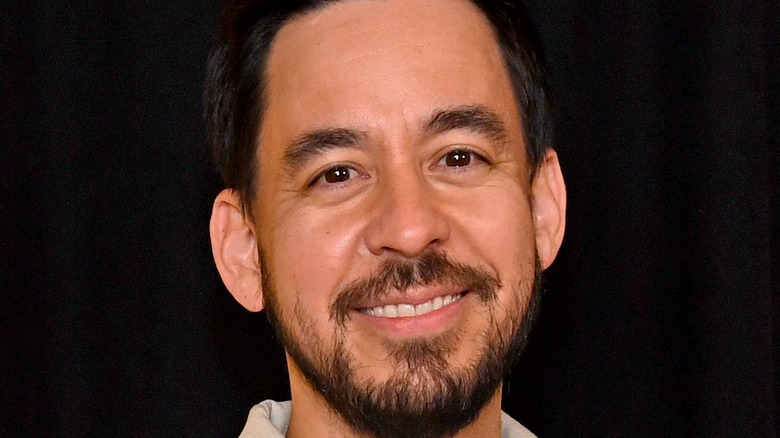 Mike Shinoda smiles