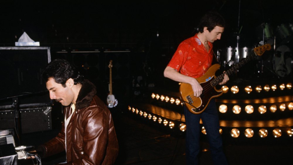 Freddie Mercury and John Deacon playing