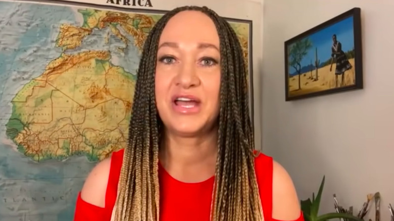 Rachel Dolezal being interviewed in braids