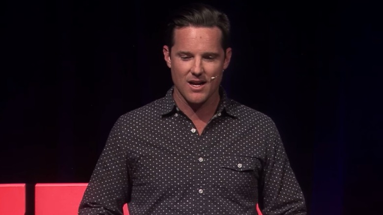 Jason Russell speaking into mic at TEDx