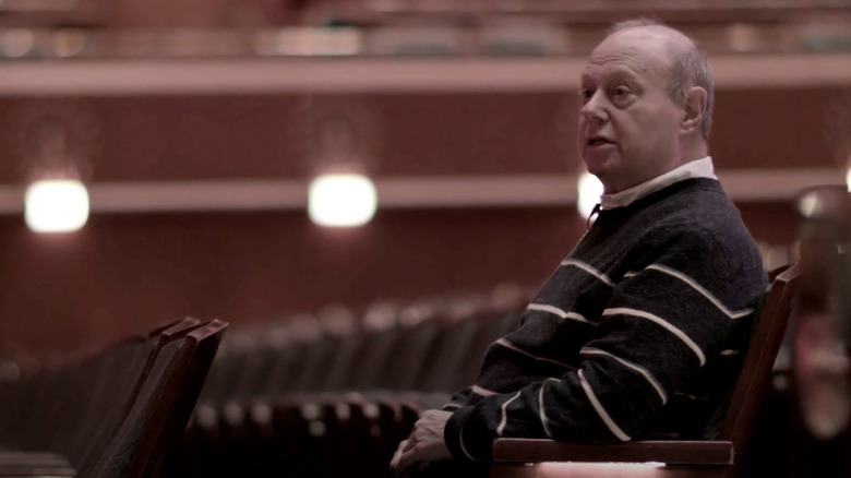 John Scher sitting