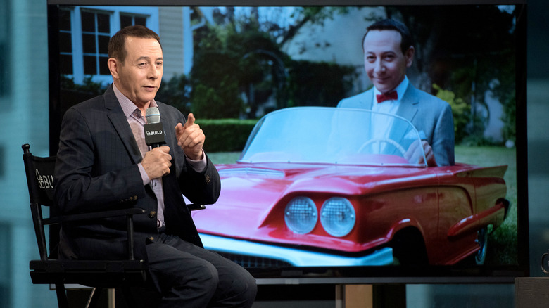 Paul Reubens talks in front of screen
