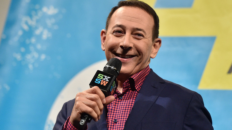 Paul Reubens smiles while speaking