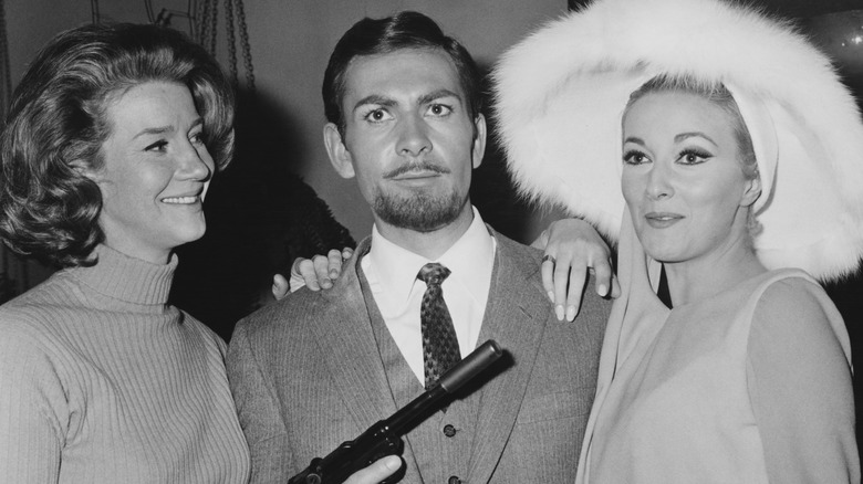 Actor Neil Connery with Bond girls