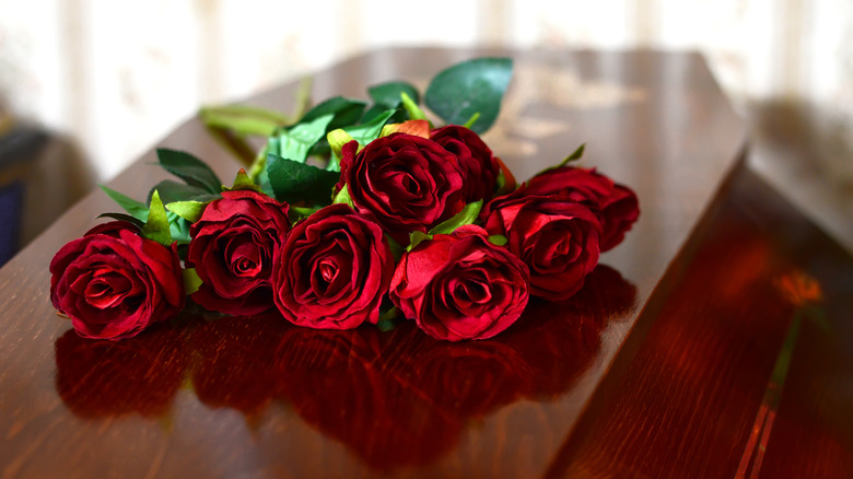 Roses on top of a casket