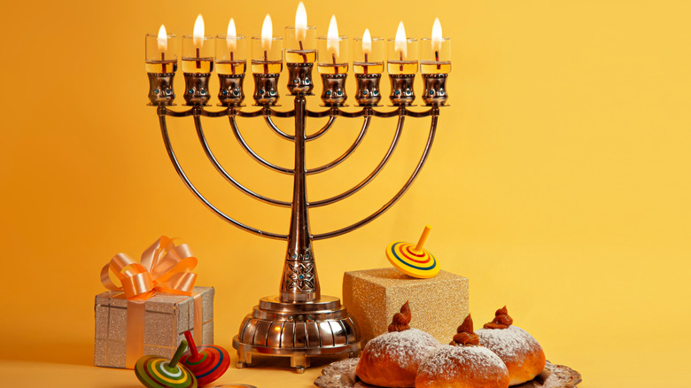 Hanukkah candle lit menorah