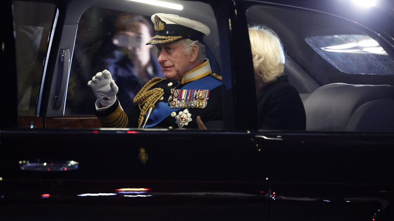 king charles in a royal limousine