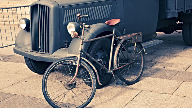 1930s bike leaning on old truck