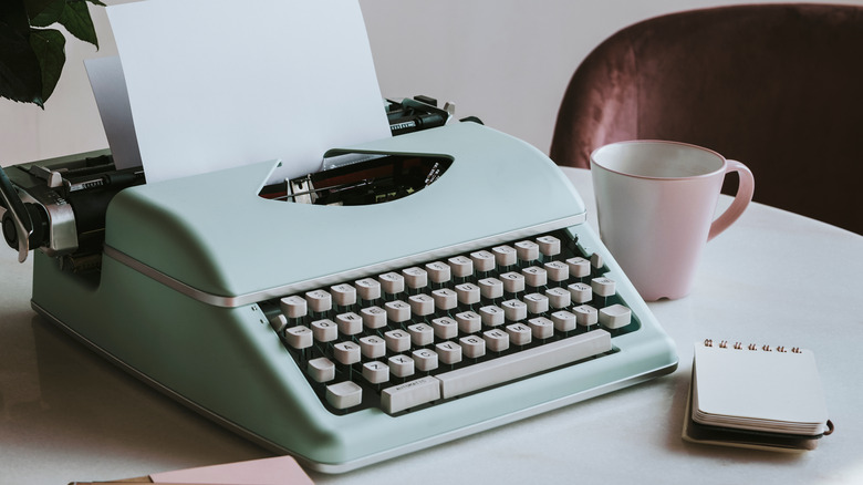 electric typewriter and mug