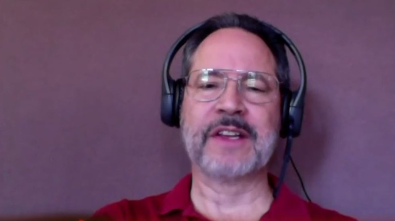 Bill Fernandez talking red shirt headphones