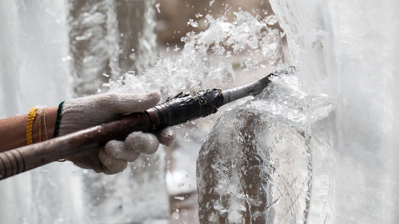 Sculptor carving ice