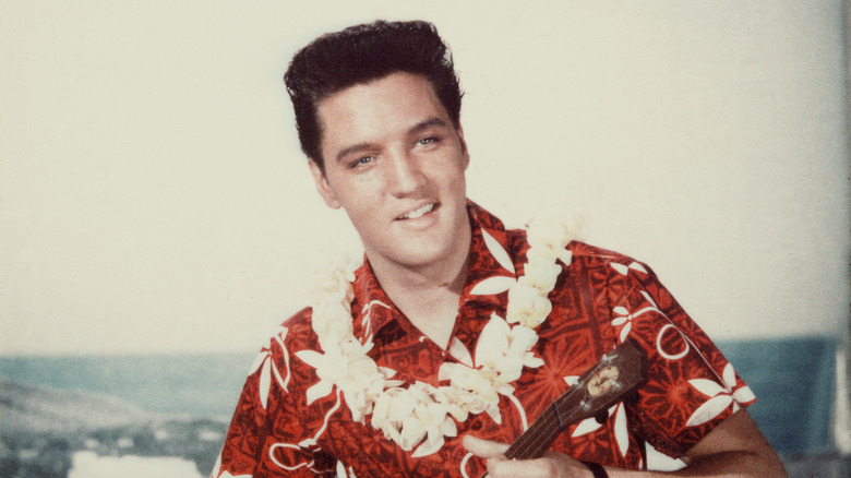Elvis Presley playing ukulele 