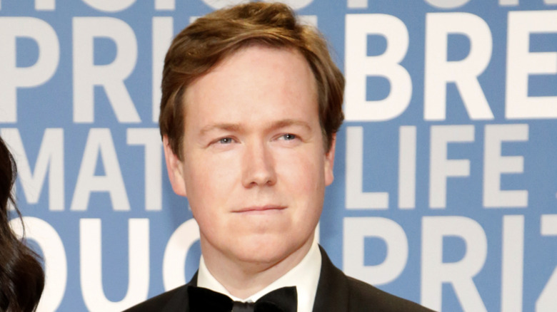 Aaron Sittig squinting in tuxedo