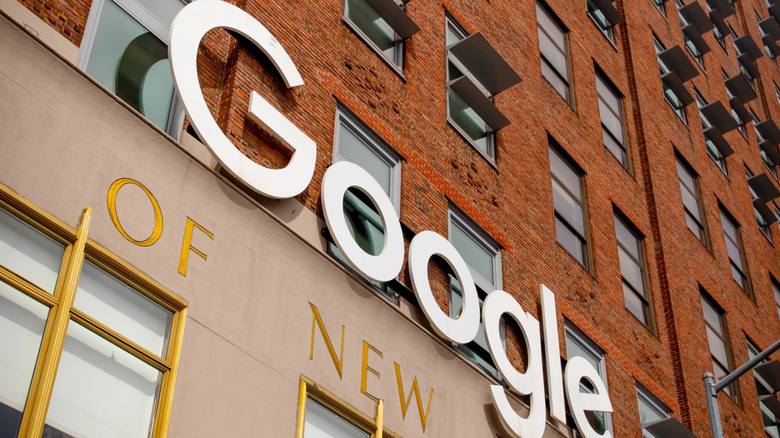 Google sign on brown New York building