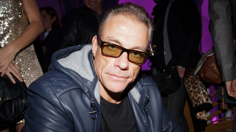 Jean-Claude Van Damme wearing glasses