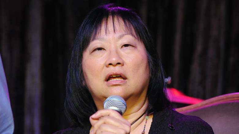 May Pang speaking onstage