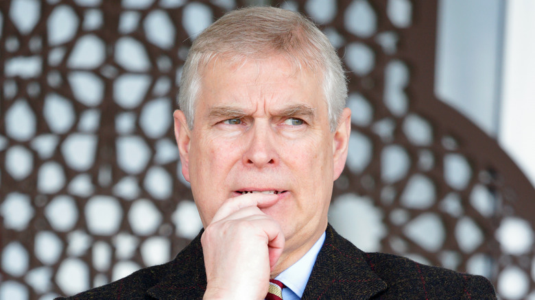 Prince Andrew hand to lip