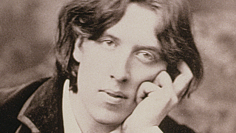 Oscar Wilde posing for a photo