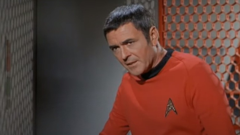 James Doohan as Scotty in red uniform