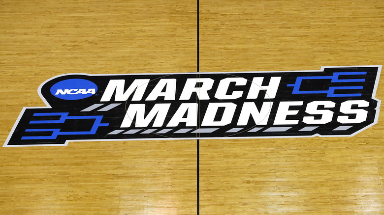 NCAA March Madness logo on court