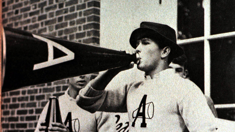 Future president George W. Bush cheerleading
