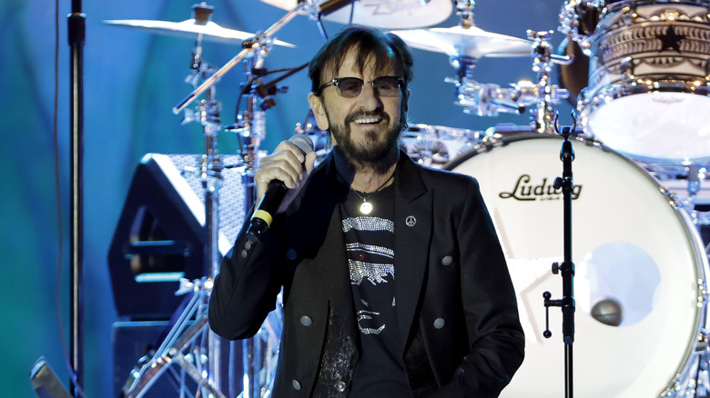Ringo Starr on stage with microphone