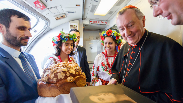Cardinal Pietro Parolin being greeted with gifts in Ukraine