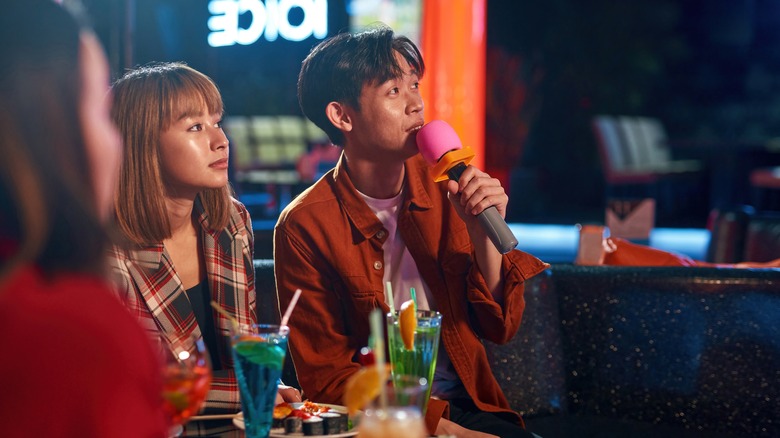 People in a karaoke bar