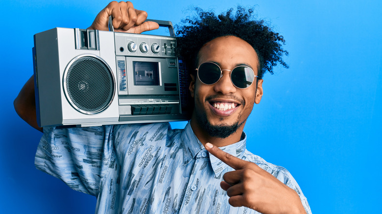 man with old-school boombox