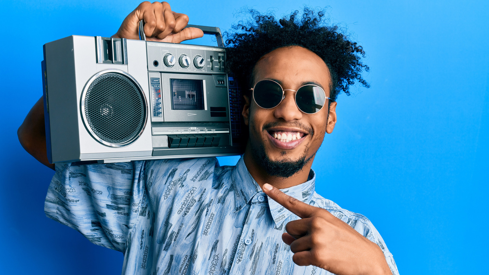 man holding boombox