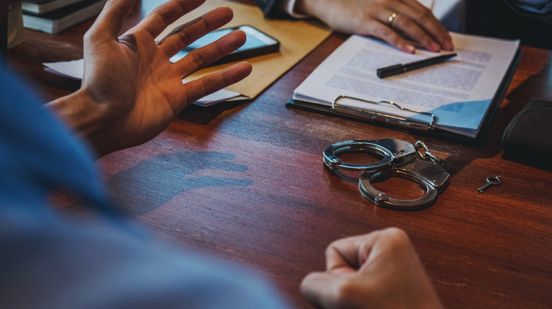 Officer interviewing criminal 