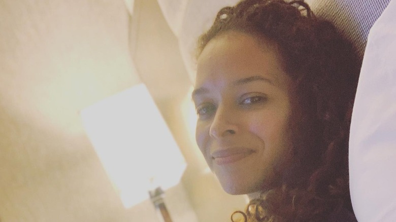 Brandi Jackson smiles and leans back