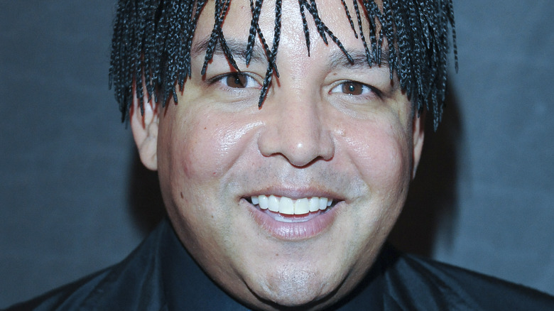 Taj Jackson smiles on the red carpet at an event