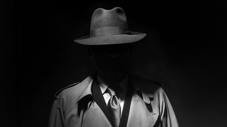 silhouette man with fedora
