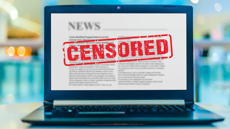 laptop with red censored sign