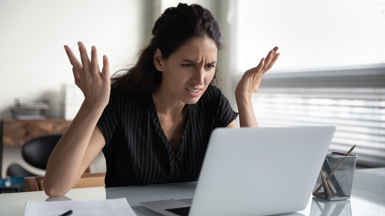 frustrated person at a computer