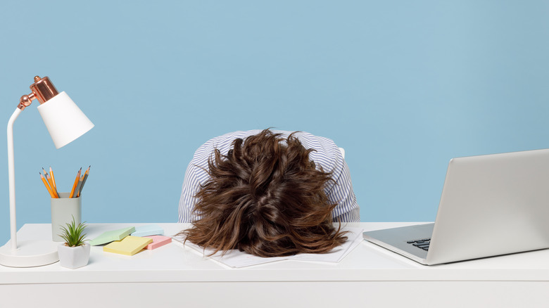 frustrated person, head in hands