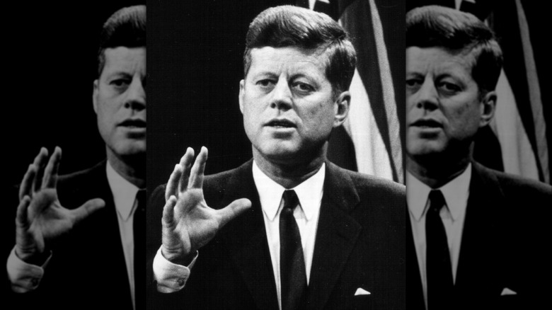 JFK raising hand