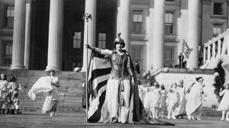 1913 Columbia striding with suffragettes