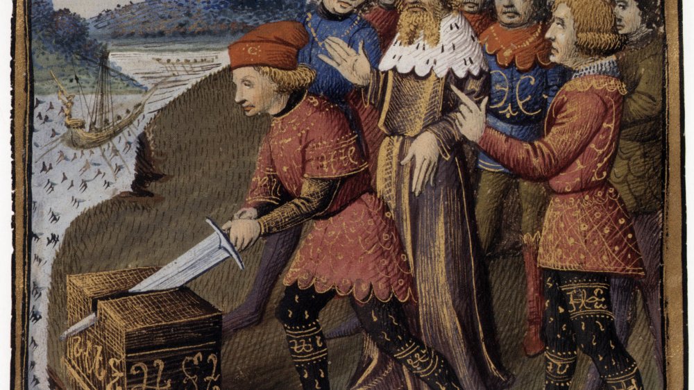 King Arthur removing the sword from the stone