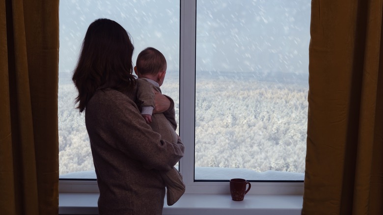 mother and baby and snow