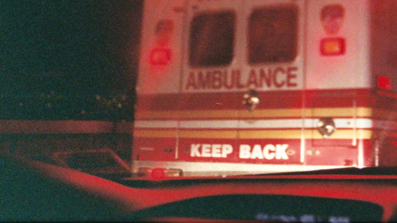 Ambulance in traffic through someone's windshield