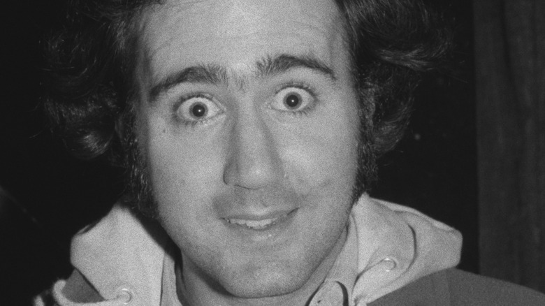 Andy Kaufman kinda smiling